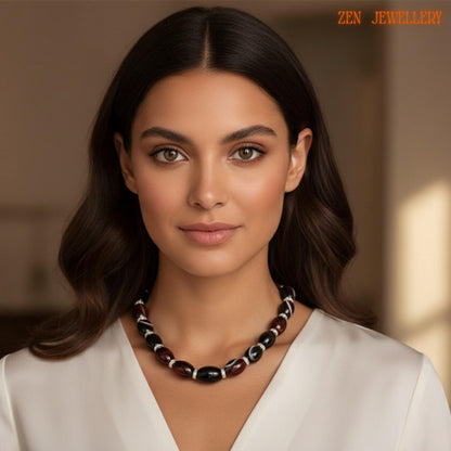 Handmade AGATE GEMSTONE statement necklace with glossy black beads and rich burgundy agate-style stones separated by rhinestone silver spacers. The polished oval gemstones create a dramatic elegant look while the silver adjustment chain provides comfortable wear. The necklace reflects natural window light beautifully and creates a sophisticated feminine appearance. Necklace size is 47 cm which equals approximately 18.5 inches in length.