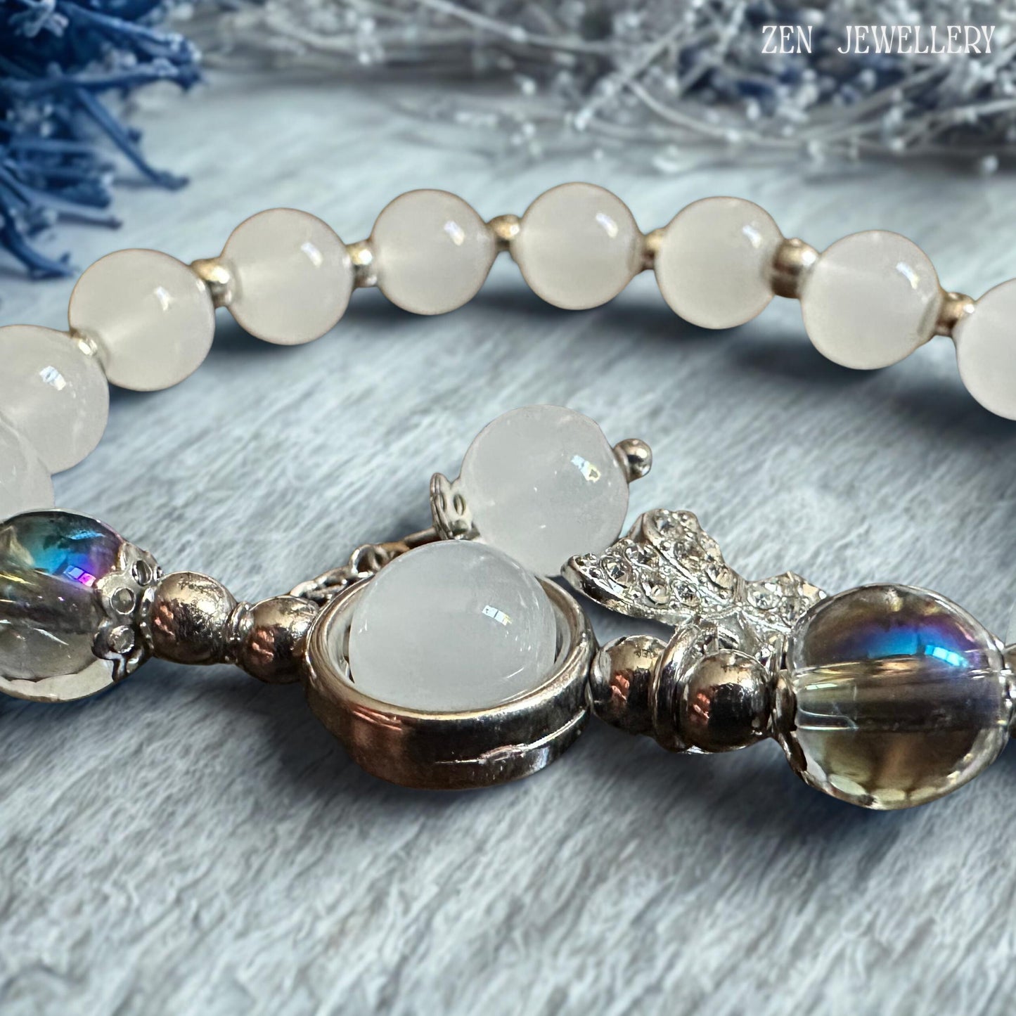 Macro detail image emphasising the polished silver spacer beads positioned between gemstone elements, revealing the careful craftsmanship and attention to detail that enhance the bracelet's sophisticated design while reflecting light beautifully against the cool white and grey gemstone colour palette for a refined and luxurious jewellery presentation.