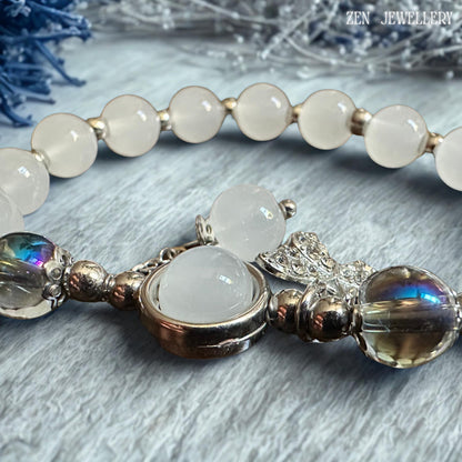 Macro detail image emphasising the polished silver spacer beads positioned between gemstone elements, revealing the careful craftsmanship and attention to detail that enhance the bracelet's sophisticated design while reflecting light beautifully against the cool white and grey gemstone colour palette for a refined and luxurious jewellery presentation.