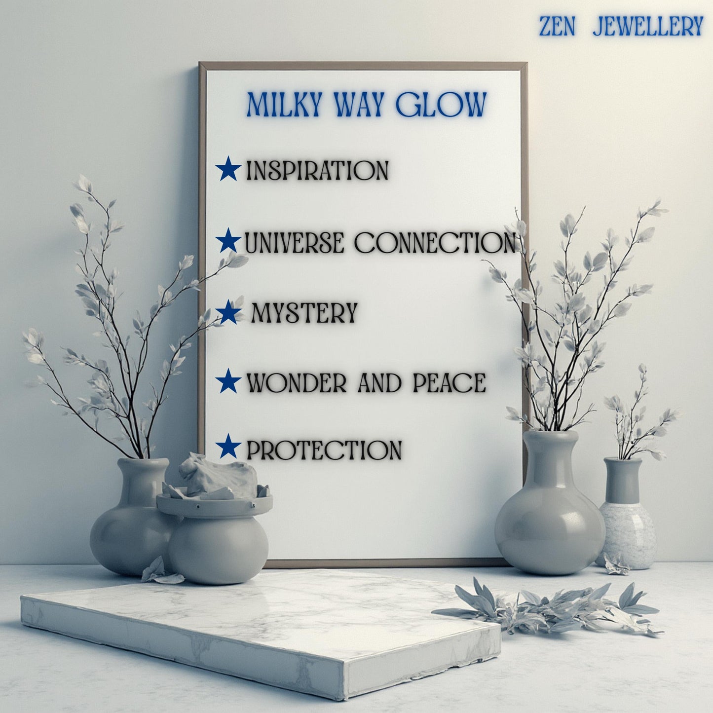 Framed white sign with the text "MILKY WAY GLOW" and bullet points listing "INSPIRATION", "UNIVERSE CONNECTION", "MYSTERY", "WONDER AND PEACE", and "PROTECTION". Vases with white branches flank the sign, which rests on a marble platform.