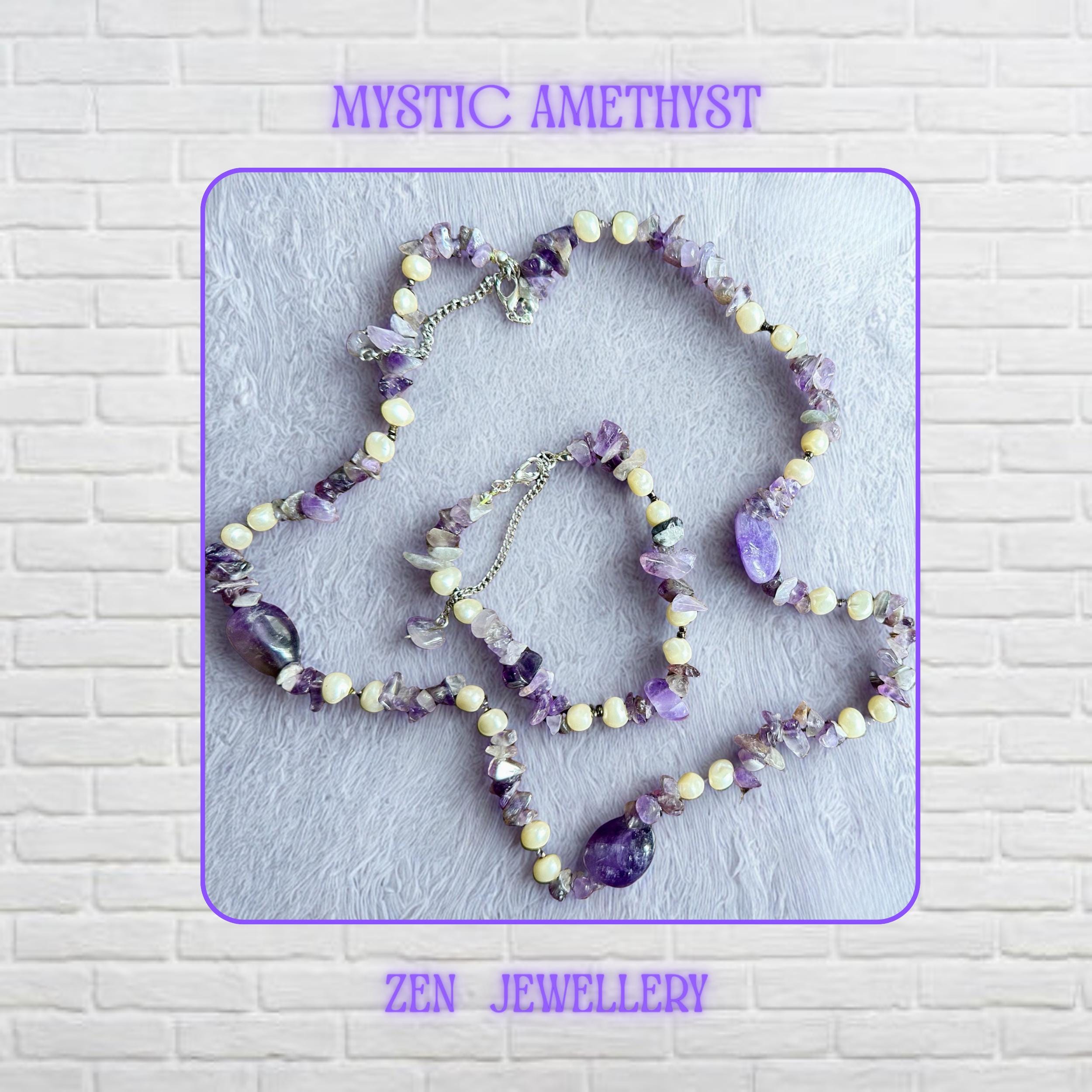 • The elegant jewellery set combines irregular natural amethyst chips with smooth cream pearl-style beads for a feminine handmade appearance. Silver extension chains and clasps add an adjustable finish while the purple gemstone beads reflect soft light beautifully. The coordinated necklace and bracelet feel lightweight and artistic for boho fashion styling.