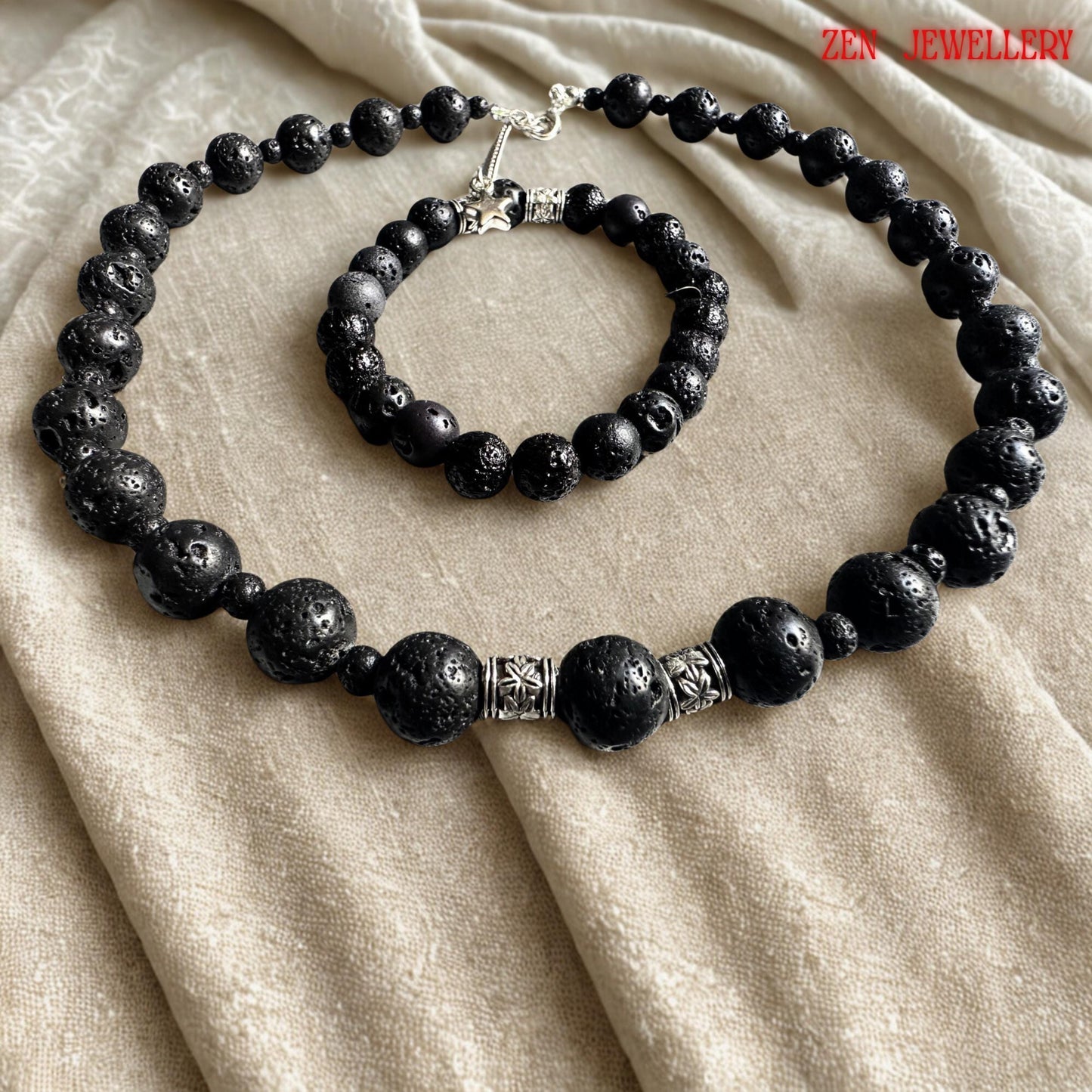 Handmade volcanic bead necklace featuring black lava stones arranged in a balanced graduated design with elegant silver spacer accents. The necklace includes a delicate silver extension chain and a small star charm that adds movement and detail to the earthy jewellery style. The porous matte stones reflect natural volcanic origins and create a calming, grounding aesthetic ideal for modern bohemian fashion lovers.