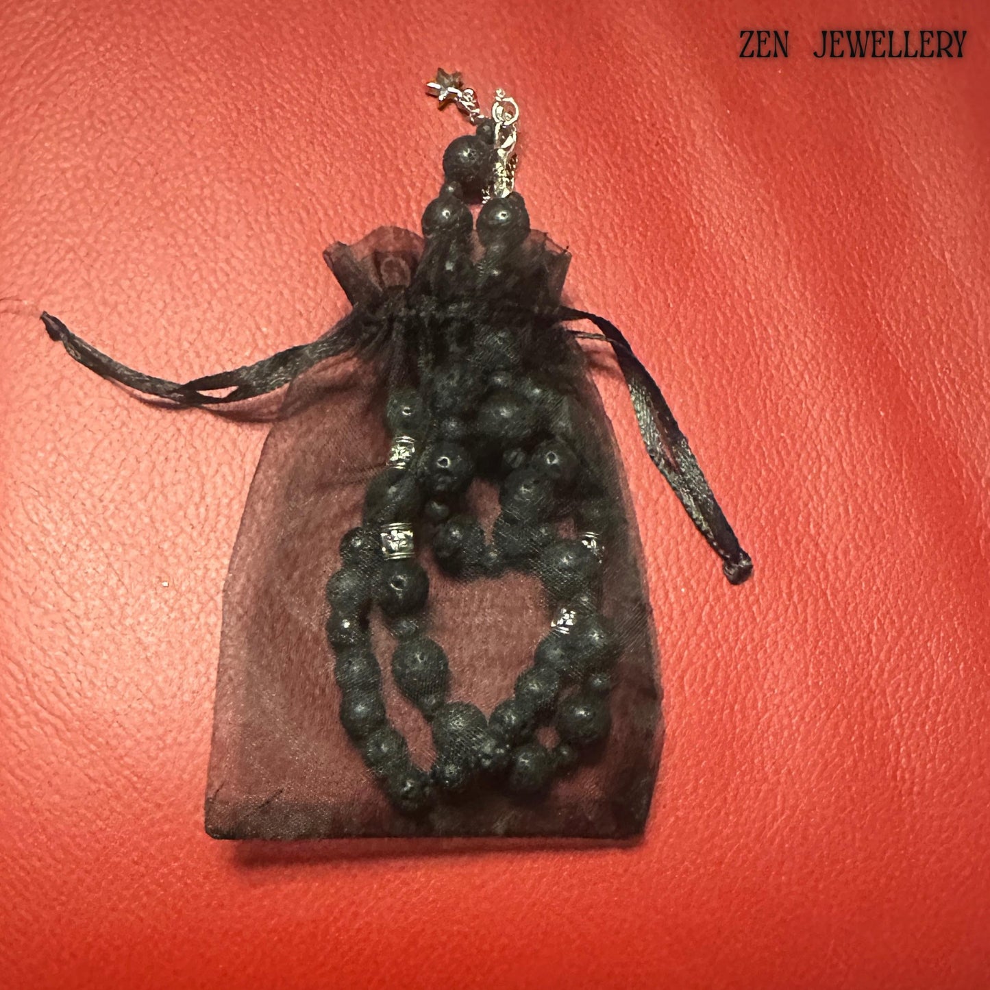 Unique textured lava stone jewelry set with elastic bracelet and adjustable necklace in a gift bag