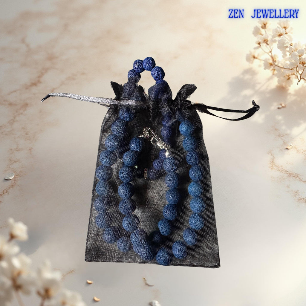 Natural navy lava stone beads paired with rhinestone spacers and delicate star pendant necklace in a gift bag