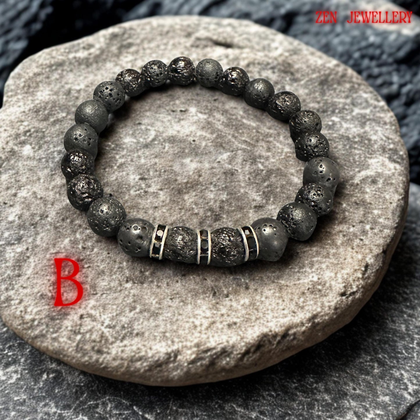 Elegant handmade lava stone bracelet featuring textured black volcanic beads combined with silver-tone black crystal spacers. The natural lava stones create a bold, earthy look while the bright black accents bring warmth and vibrant detail to the minimalist bracelet design. Bracelet measures approximately 17 cm.