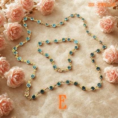 Sparkling Austrian crystal beads in aqua tones on a golden chain, photographed on neutral background for elegant appeal.