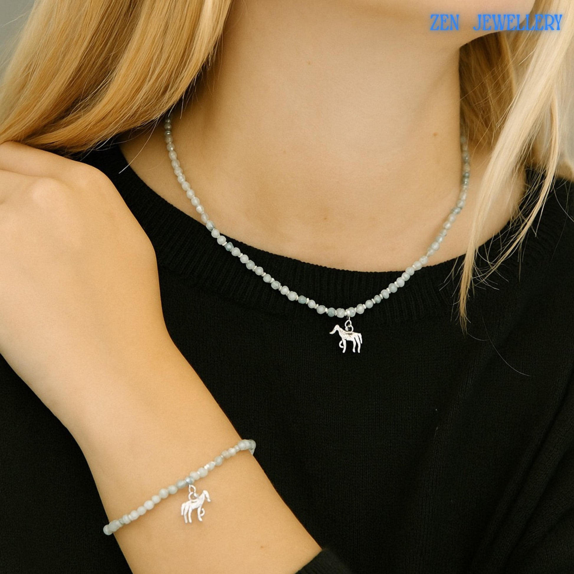 Detailed image focusing on the horse charm bracelet featuring shimmering white crystal beads connected to sterling silver findings. The horse silhouette charm creates a meaningful equestrian theme while maintaining a minimalist and elegant appearance. Adjustable chain allows a flexible fit while the faceted crystal surfaces create soft reflections from multiple angles.
