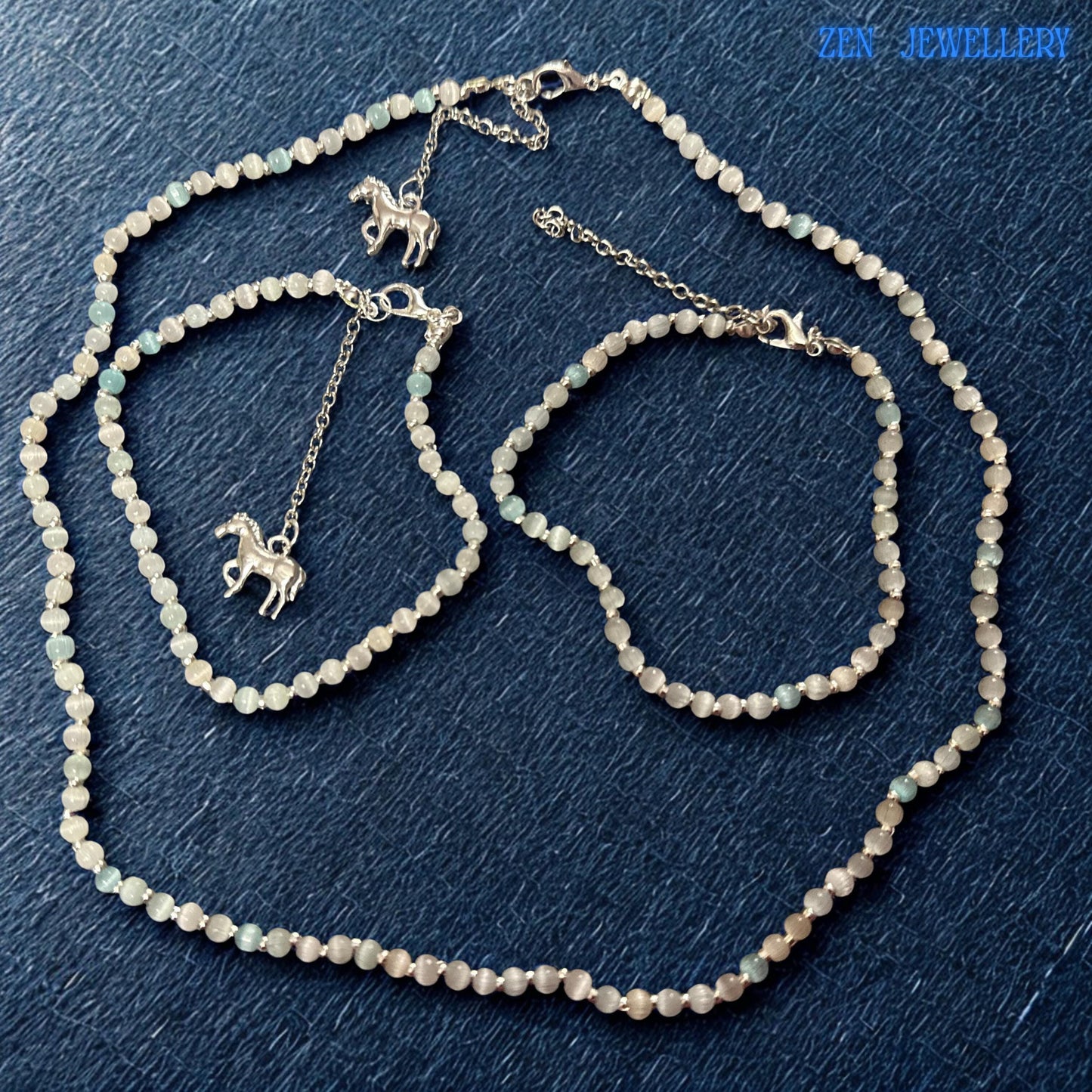 Close-up of the sterling silver clasp and extension chain illustrating the quality finishing details of the handmade jewellery. The polished silver hardware complements the luminous white crystal beads and adds durability while maintaining an elegant appearance. The extension chain provides sizing flexibility for various neck and wrist measurements.