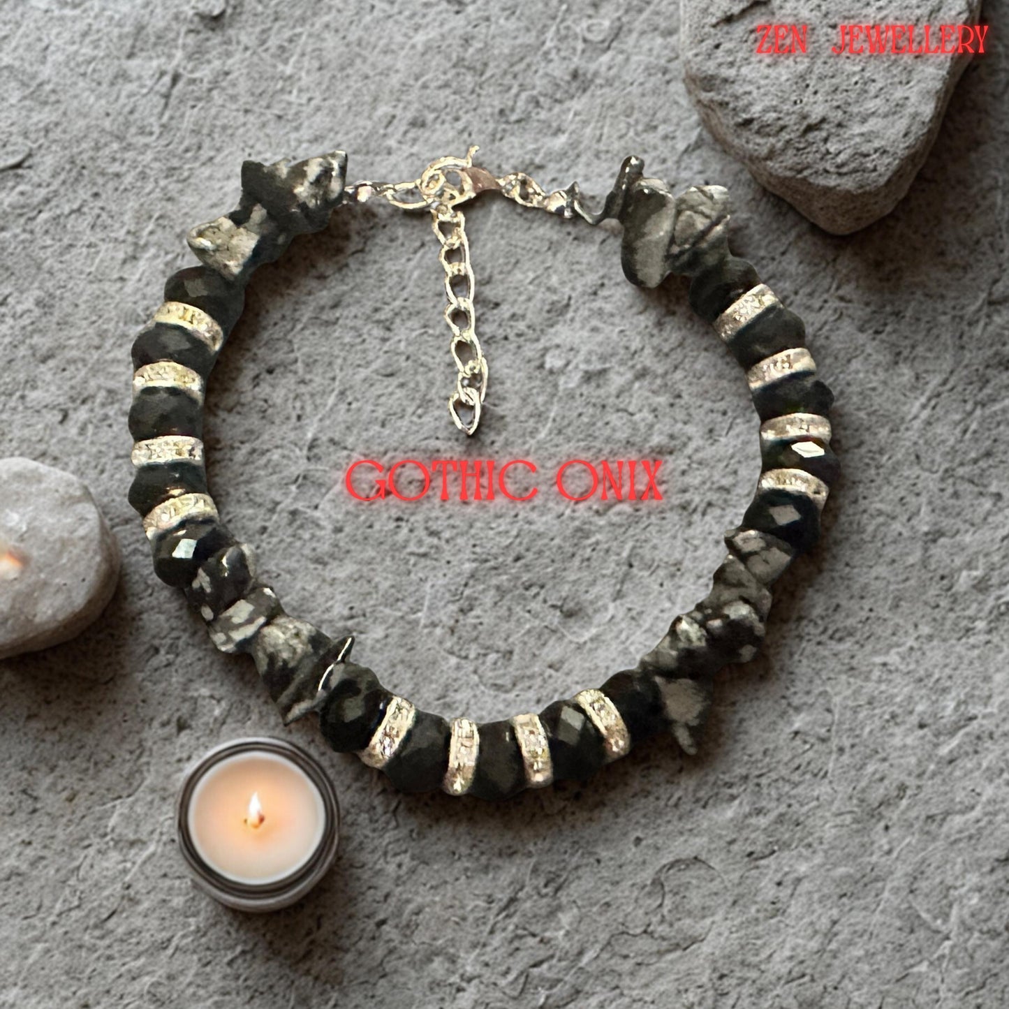 Detailed image focusing on the natural grey gemstone chips arranged alongside black crystal beads. The irregular gemstone shapes create visual interest and depth while contrasting beautifully with the structured faceted crystals. Silver accents enhance the contemporary style and elegant appearance of the bracelet.