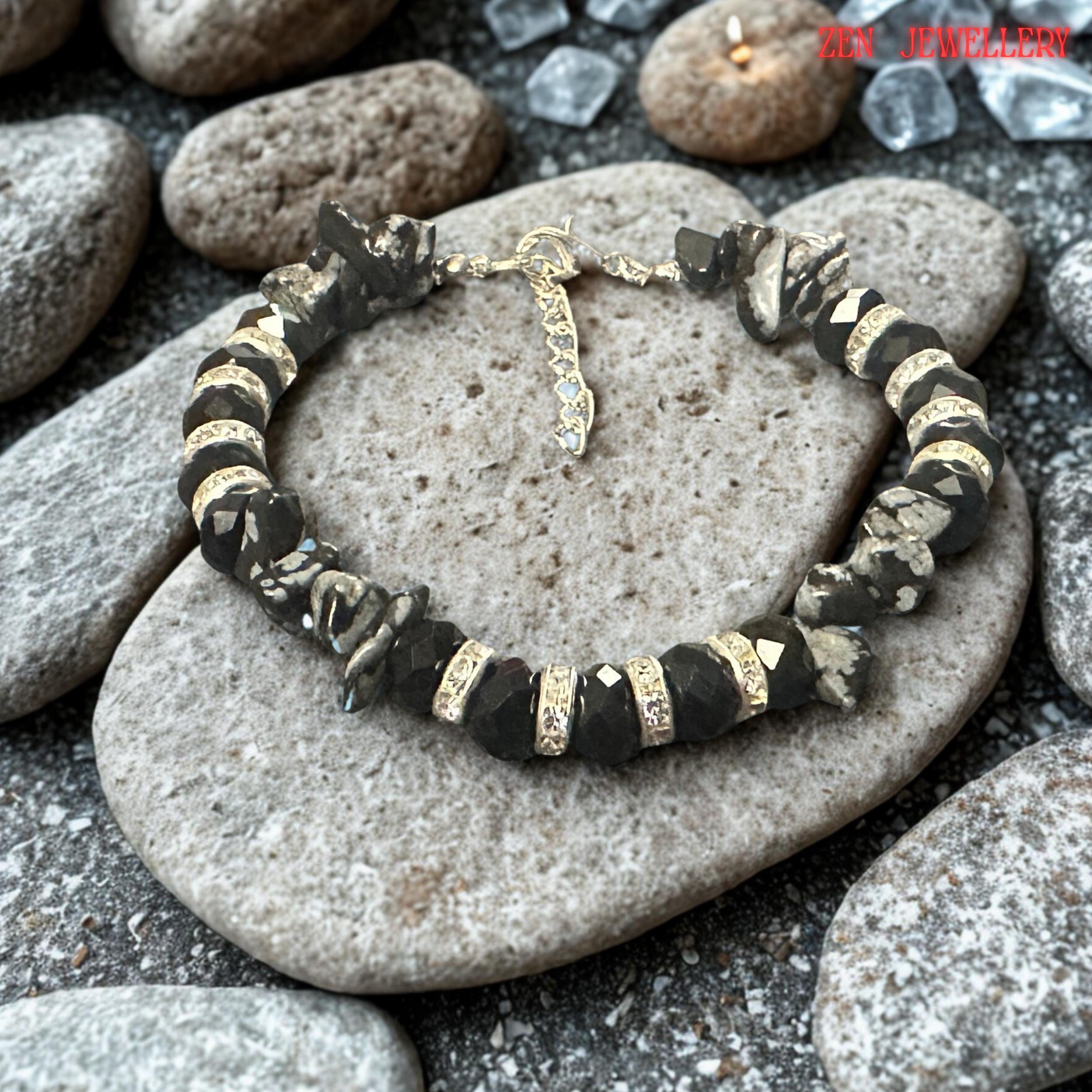 Detailed close-up of the silver clasp and extension chain. The polished silver components provide secure fastening while allowing adjustable sizing for greater comfort. The quality hardware complements the black and grey colour palette while adding durability and functionality to the bracelet.