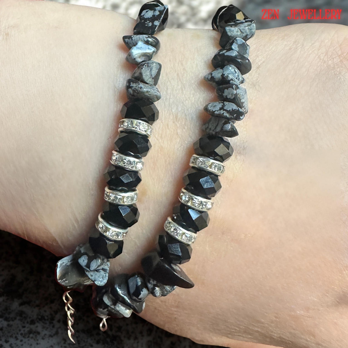 Detailed image showcasing the natural patterns and textures found within the grey gemstone chips. Each gemstone displays unique markings and colour variations, adding individuality and organic beauty to the bracelet. The natural stones balance the brilliance of the crystal elements.