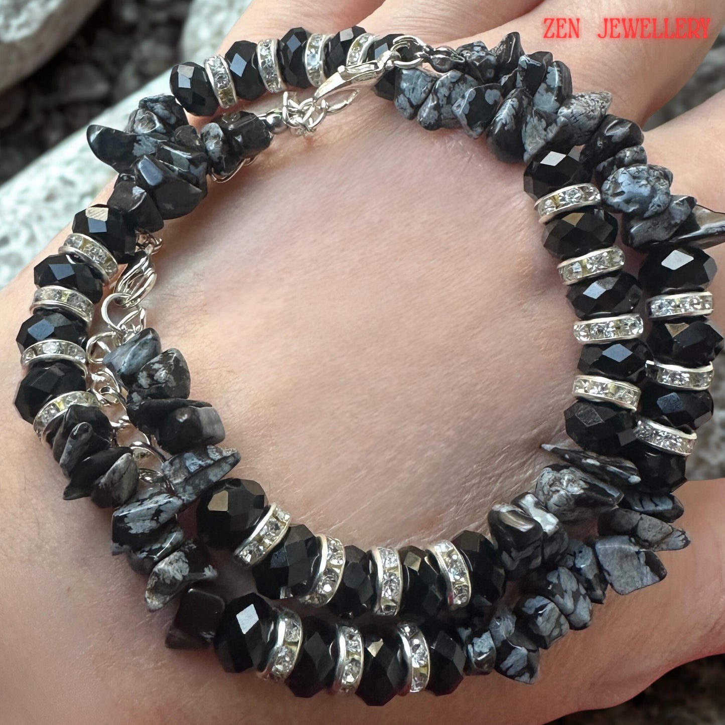 Close-up perspective focusing on the faceted crystal beads. Their geometric surfaces reflect light from multiple angles, creating subtle sparkle and sophistication. The rich black colour enhances the bracelet's modern and glamorous aesthetic while remaining versatile for many outfits.