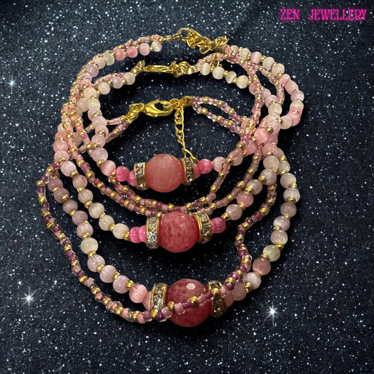 The bracelet is photographed while worn on the wrist, helping demonstrate scale and how the multiple strands drape naturally against the skin. Soft pink crystal beads create a feminine colour palette while gold spacer beads add warmth and contrast. A large raspberry pink bead forms the focal point and is surrounded by rhinestone accents for additional sparkle. Measurement information and sizing guidance are included within the product description