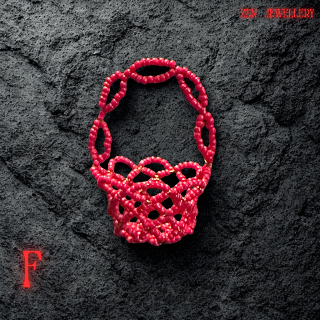 A side view highlights the curved walls of the basket formed from sparkling red Miyuki seed beads.