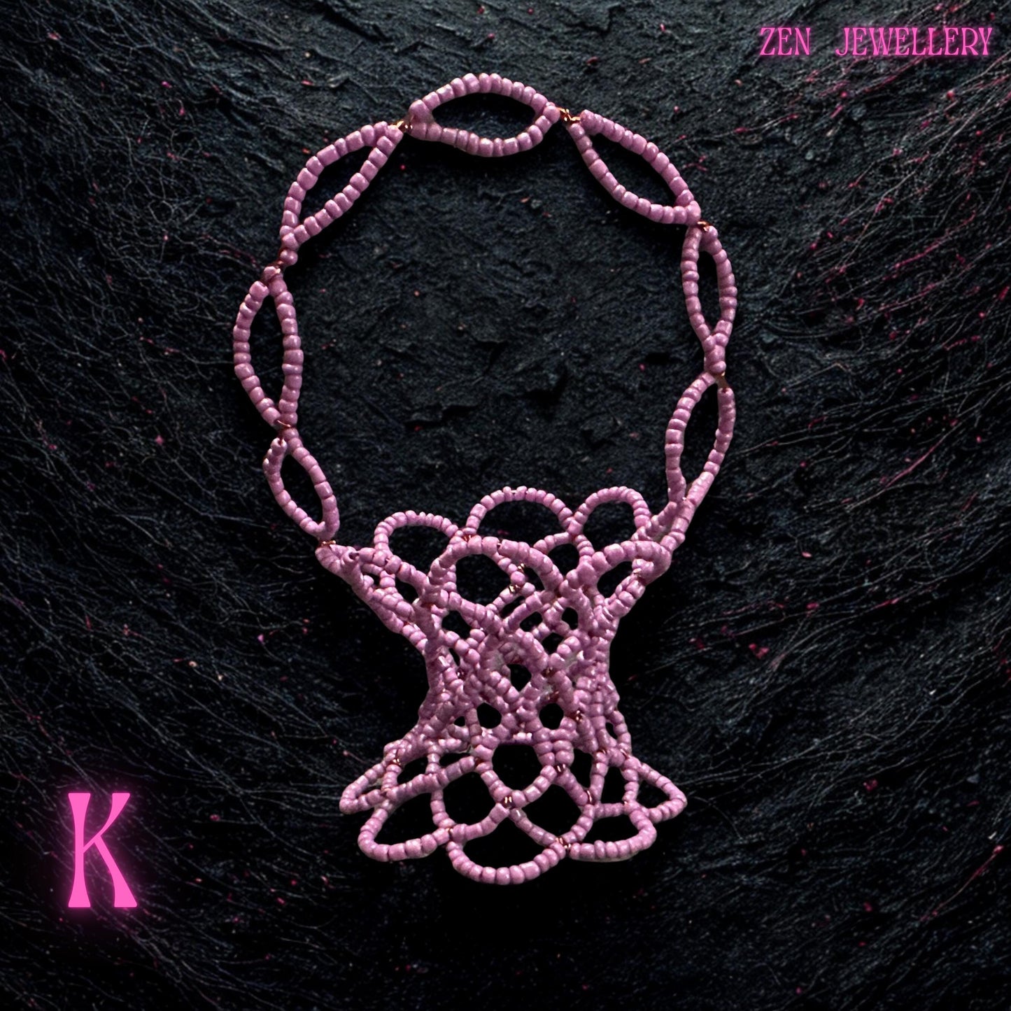 Small pink beadwork basket photographed on a clean background to highlight its colour and craftsmanship.