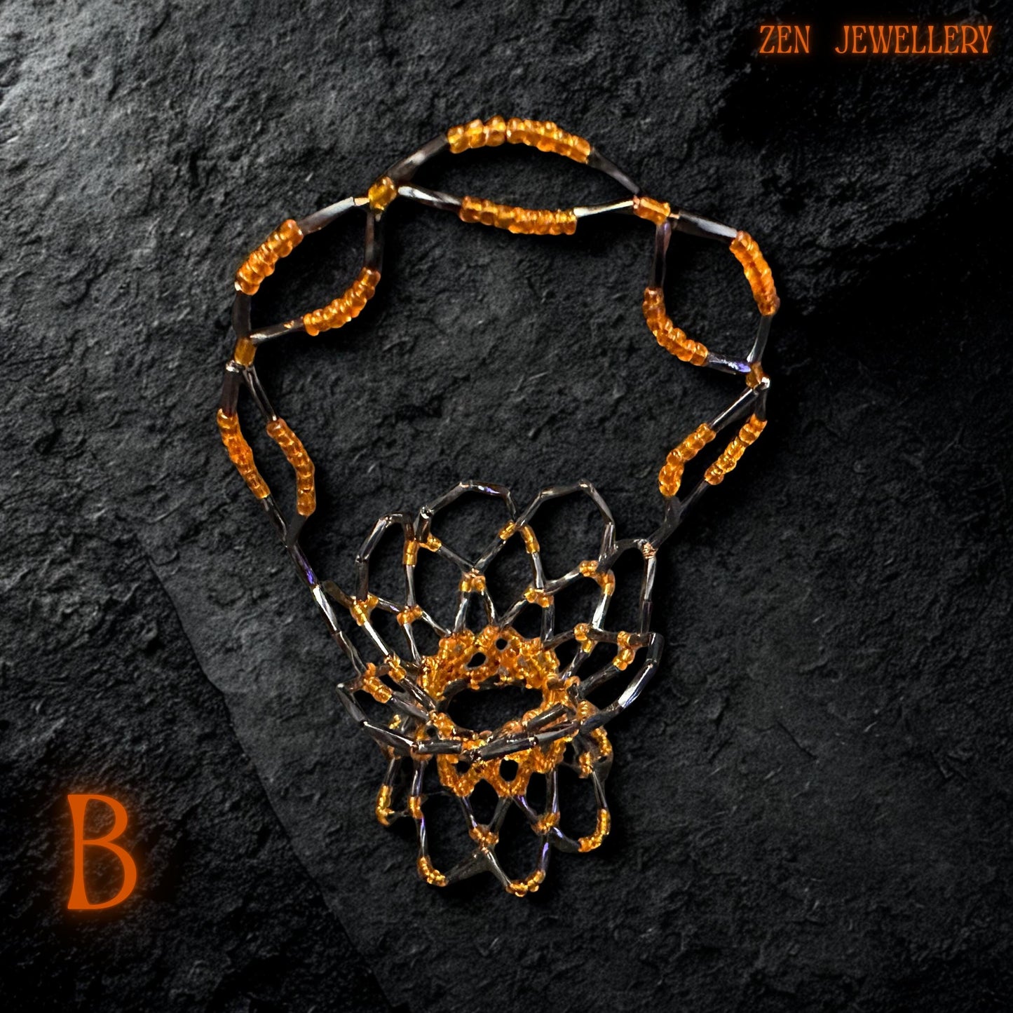 Overhead view of the handcrafted basket showing its symmetrical orange and black bead arrangement.
