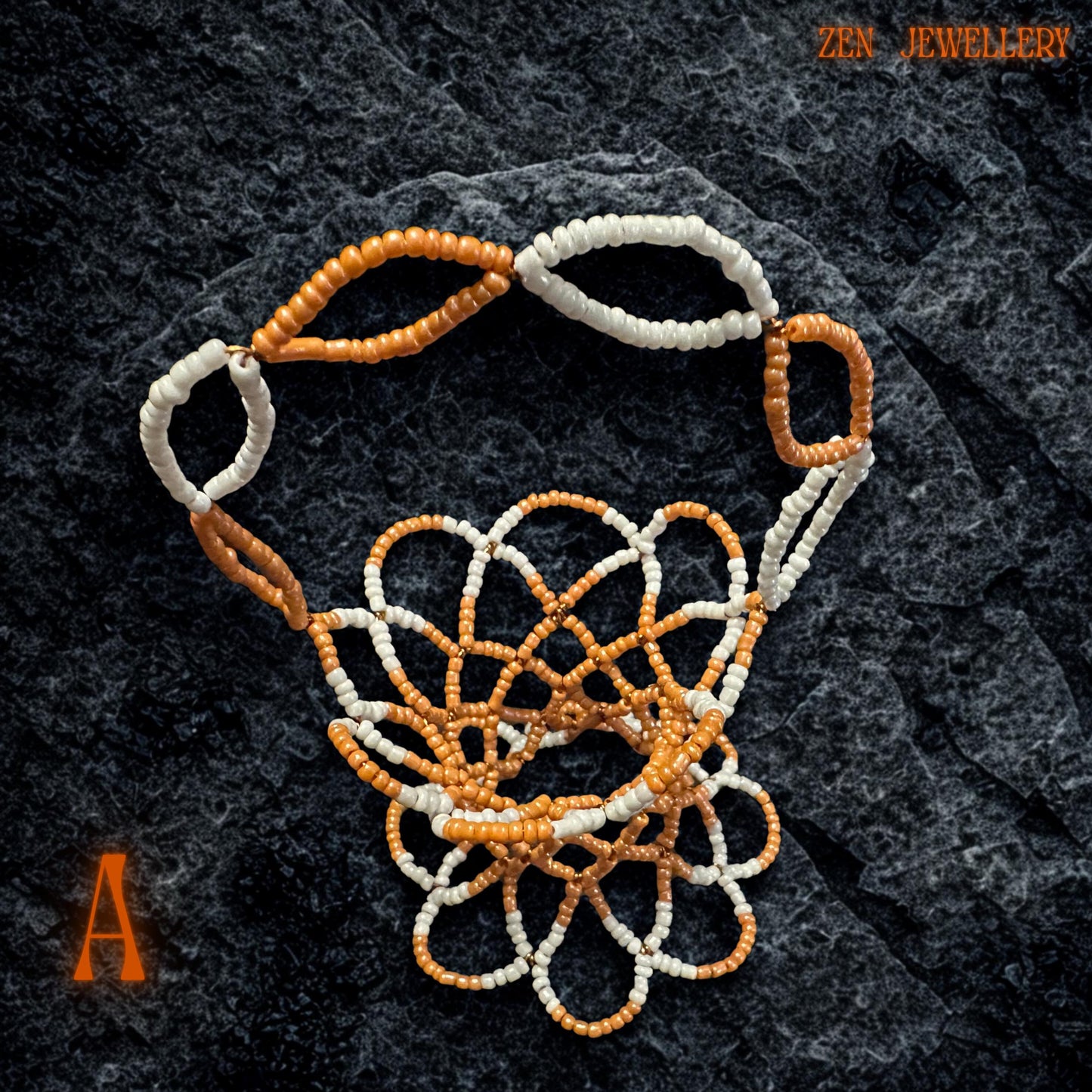 The orange and white beaded basket displayed as a colourful trinket holder on a wooden surface.