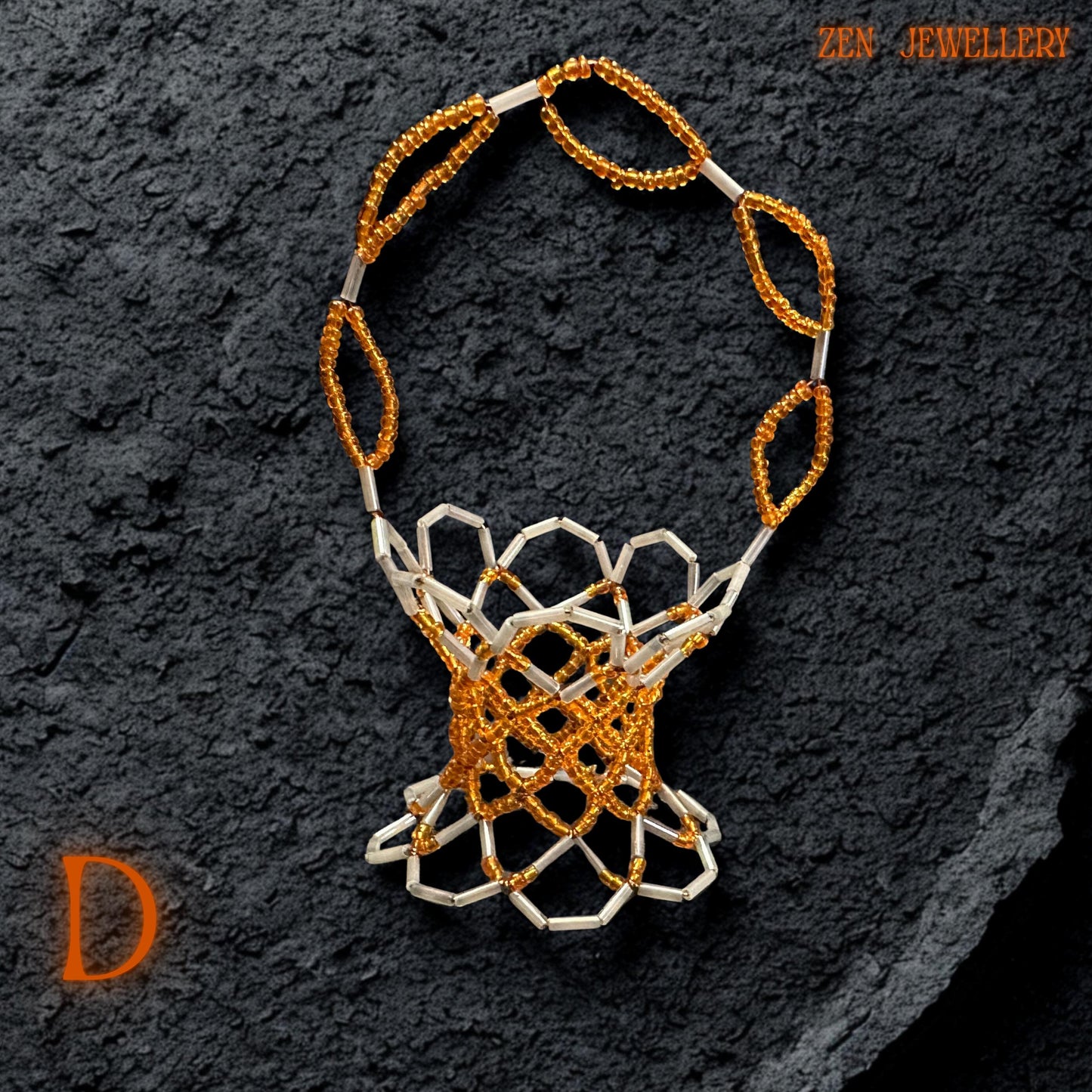 A close-up of the orange and white Miyuki beads showcasing their polished, high-shine surface.