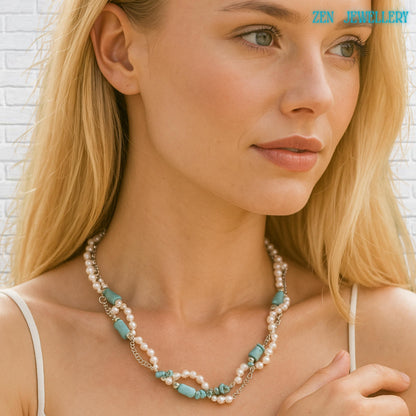 Close-up of boho chic turquoise necklace showing handcrafted bead arrangement, turquoise chips mixed with pearls, sterling silver clasp and chain detail visible, styled for everyday elegant wear, on a beautiful blond model.