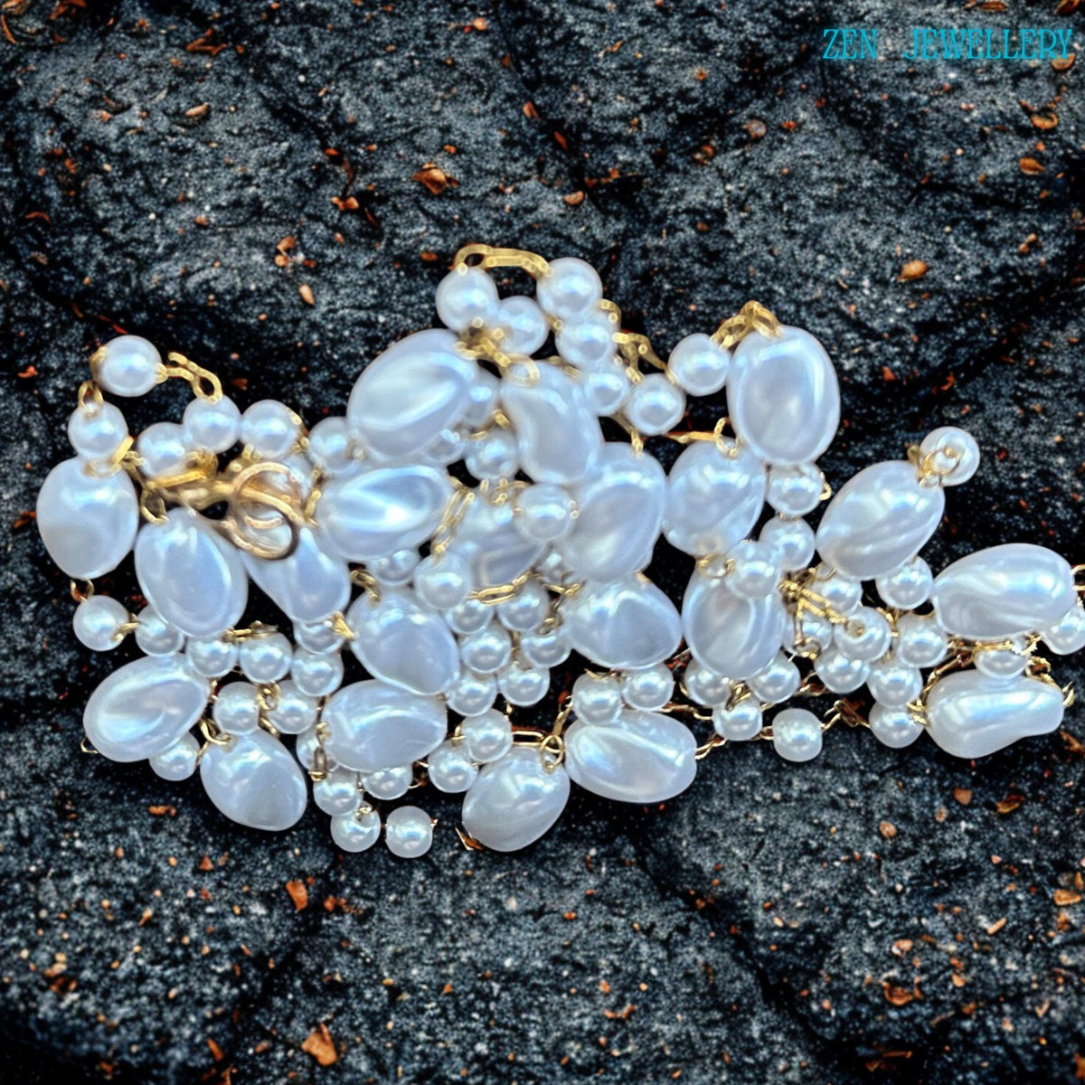 The romantic handmade necklace features flowing white pearl-style beads connected with elegant gold chain links in an airy layered design. The glossy beads create soft shine and texture while the warm gold details add refinement and elegance. The necklace works beautifully with bridal styling, summer dresses, evening outfits, or layered jewellery looks.