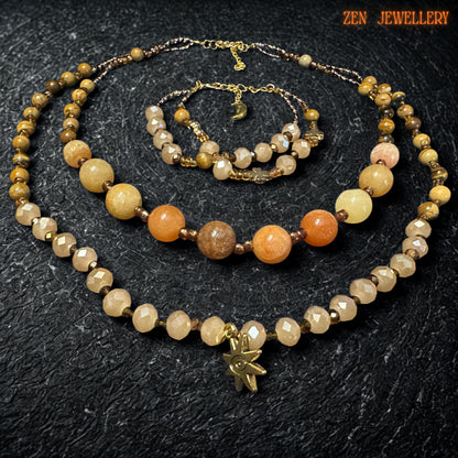 Matching bracelet shown with the same warm gemstone colour palette and delicate gold details. The bracelet looks lightweight and comfortable, with a handmade artisan finish that pairs beautifully with the necklace. Close detail of the polished gemstone beads showing natural variations in tone from soft beige to warm honey and amber. The faceted crystal beads add sparkle and depth, making the jewellery feel rich and luxurious.