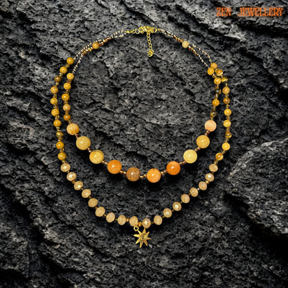 Elegant layered necklace arranged flat to show the full design, bead spacing, and clasp details. The necklace includes two strands and mirrors the warm golden colour palette for a coordinated handmade jewellery set.