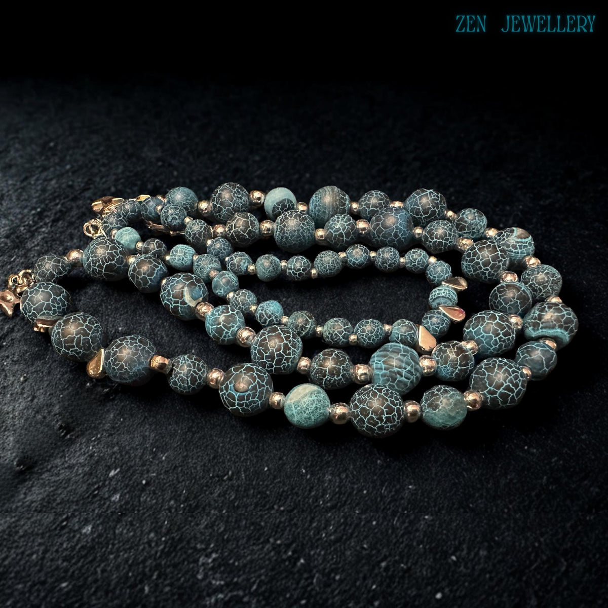 Handmade Blue Crackle Agate necklace displayed from an angled perspective highlighting the balanced arrangement of graduated turquoise gemstone beads, silver spacer accents, polished silver chain extension, and dangling star charms while emphasizing the artistic handcrafted structure, celestial bohemian styling, and comfortable wearable design suitable for modern fashion lovers.