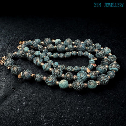 Handmade Blue Crackle Agate necklace displayed from an angled perspective highlighting the balanced arrangement of graduated turquoise gemstone beads, silver spacer accents, polished silver chain extension, and dangling star charms while emphasizing the artistic handcrafted structure, celestial bohemian styling, and comfortable wearable design suitable for modern fashion lovers.