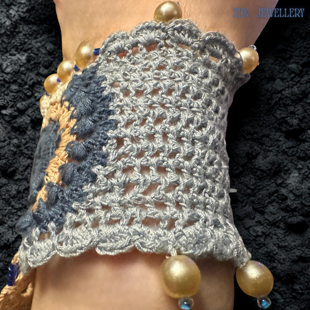High neckline crochet bib bracelet with layered embroidered circles in navy, pale blue, cream and champagne tones, accented by small pearls and lace-inspired openwork details, creating a bold yet feminine handmade statement jewellery piece suitable for navy dresses, weddings and artistic fashion styling.