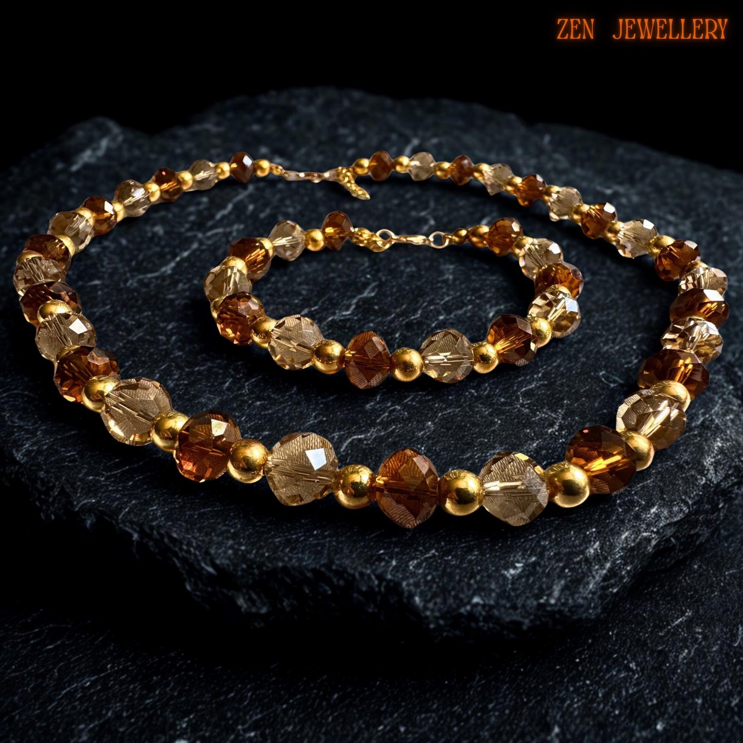 Handmade crystal jewellery set featuring alternating caramel and champagne AUSTRIAN CRYSTAL beads separated by glossy gold spacer beads and finished with elegant gold clasp closures. The rich amber tones create warmth and depth while the faceted bead texture adds beautiful sparkle and graceful movement.