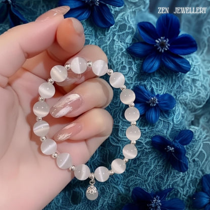 Detailed product image presenting the contrast between the luminous white gemstone beads and translucent grey gemstone accents, demonstrating the bracelet's balanced colour palette and contemporary elegance while allowing buyers to visualise the sophisticated appearance that pairs effortlessly with casual outfits, formal wear and special occasion ensembles.