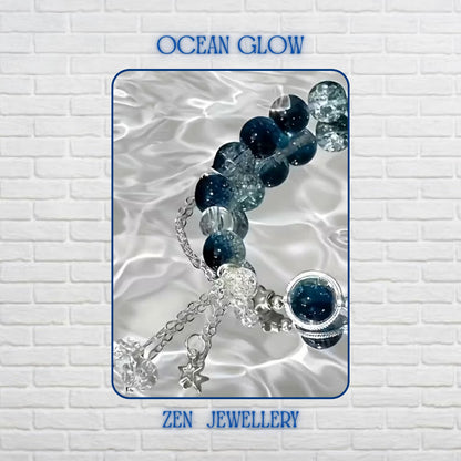 Close-up view highlighting the rich navy-blue gemstone beads with a glossy polished finish. The beads are combined with sparkling crackle crystal beads that create depth, texture, and ocean-inspired elegance. Silver-toned decorative accents separate the gemstones, while the central blue gemstone charm draws attention to the sophisticated design. Bracelet length is 19 cm (7.48 inches) with adjustable sizing.