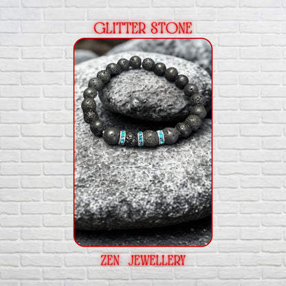Close-up view of natural volcanic lava beads showing porous texture and organic matte black finish beside sparkling turquoise rhinestone spacer details. The bracelet creates a minimalist bohemian style inspired by grounding volcanic energy and modern handmade jewellery design. Different bead sizes create balance and visual interest across the bracelet.