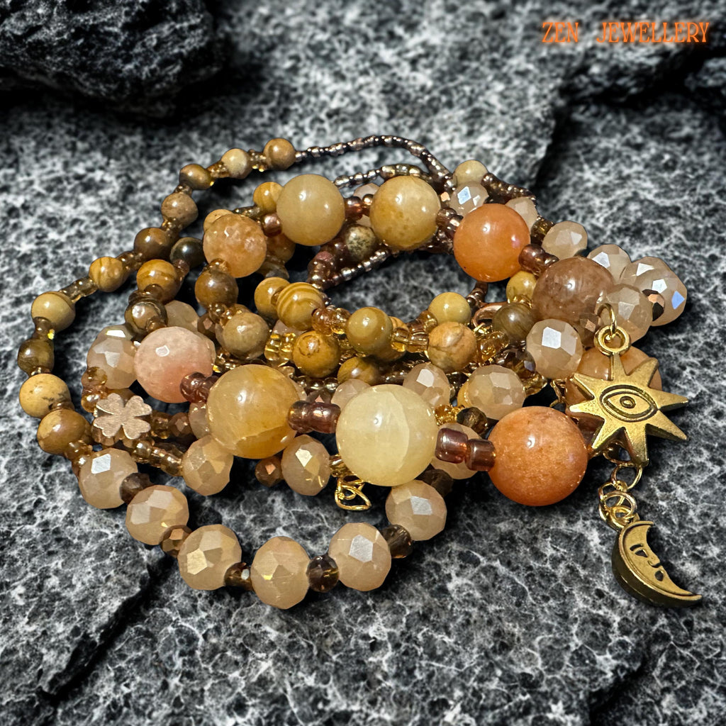 Elegant boho jewellery set with warm honey and caramel beads paired with sparkling champagne crystal details. The design feels lightweight, artisanal, and easy to style with neutral or earthy outfits.
The layered strands create graceful movement and a soft luxurious look. The matching bracelet mirrors the necklace beautifully, making this a complete handmade gemstone jewellery set.