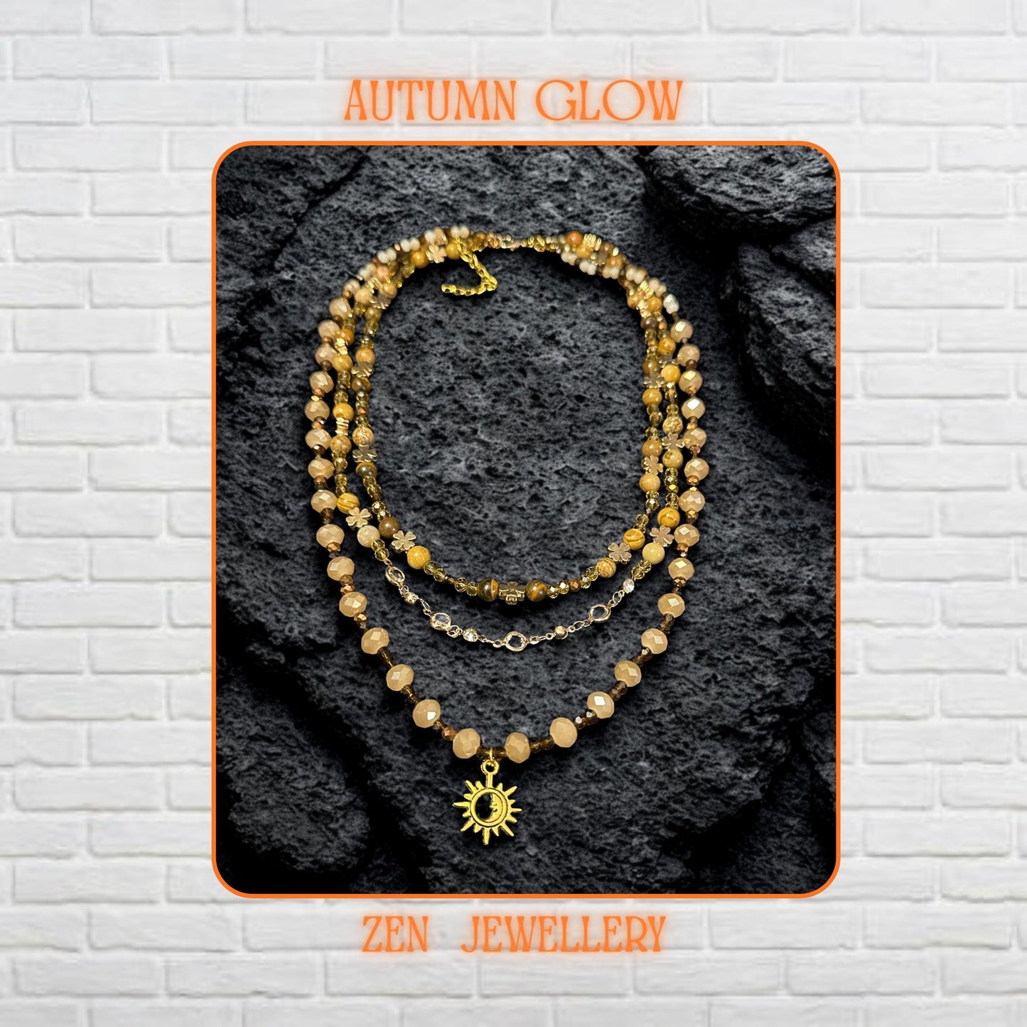 Close-up of natural gemstone beads in beige, brown, and gold shades forming a triple-strand boho necklace.