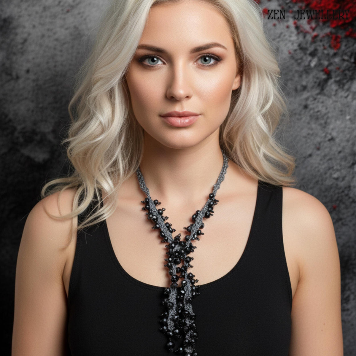 Artisan black crystal necklace and bracelet set made with charcoal silk crochet and sterling silver clasps, designed in a bold chunky statement style. The image focuses on the craftsmanship details, including tightly crocheted silk patterns and carefully spaced crystal clusters. The faceted beads shimmer subtly under light, giving the jewellery an elegant, glamorous appearance suitable for parties, evening occasions, or artistic fashion styling.