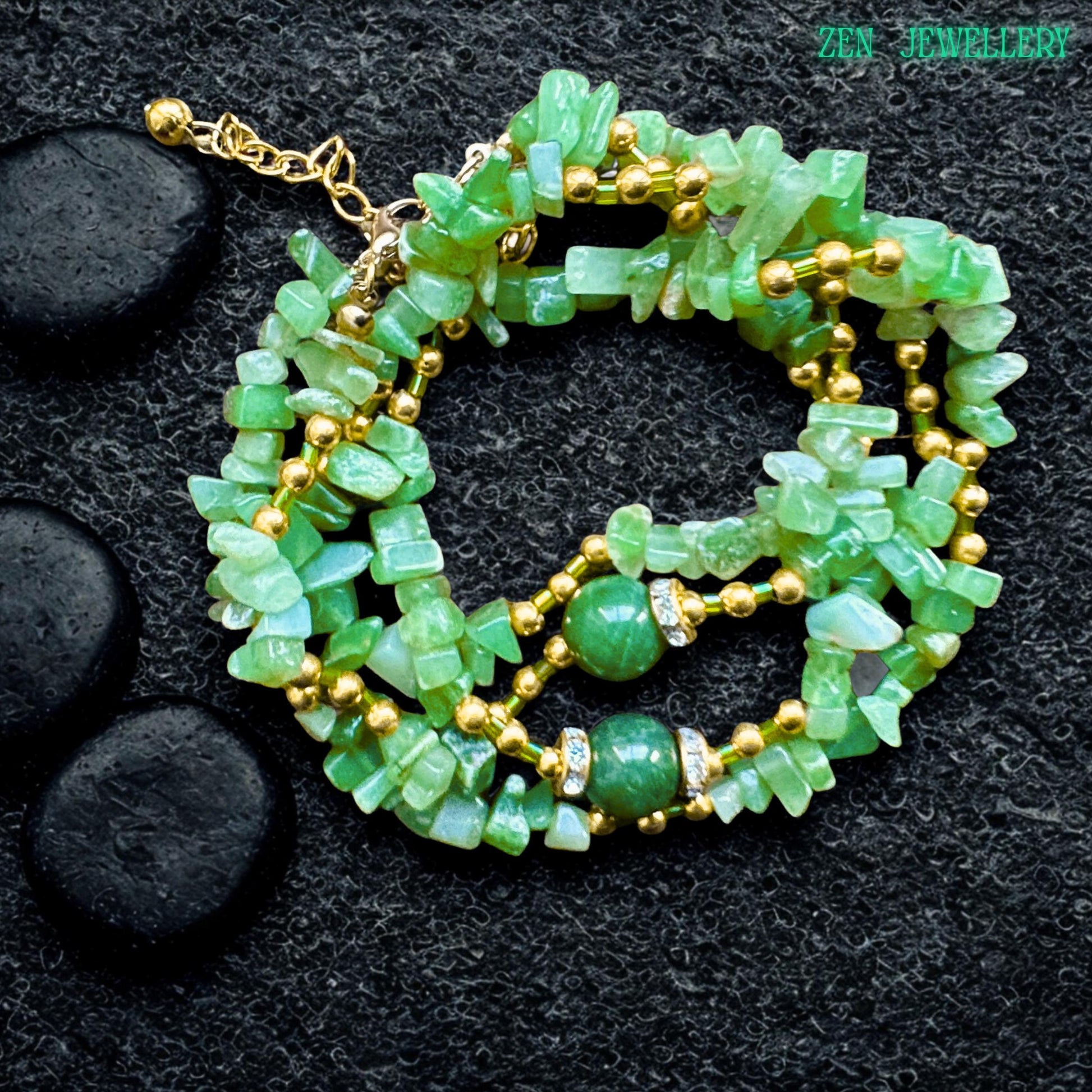 Close-up view of polished green jade chips mixed with shiny golden spacer beads, creating an elegant boho gemstone jewellery design with natural earthy texture and sparkle. Natural GREEN AVENTURINE jewellery set with a gold clasp and layered gemstone design styled beautifully for elegant bohemian fashion lovers.