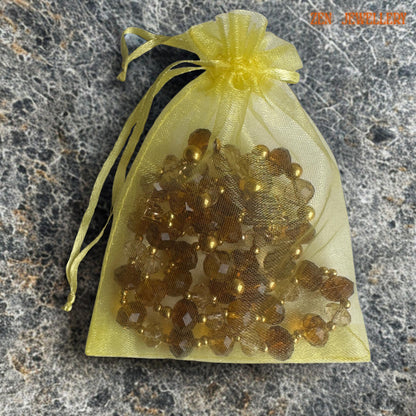 Elegant jewellery set featuring handmade brown and champagne crystals with gold bead highlights for women with free pouch and free delivery UK