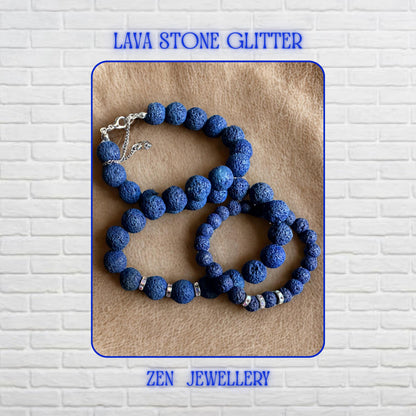 A bold navy blue lava stone jewellery set designed with graduated volcanic beads and shimmering rhinestone spacers. The necklace combines different bead sizes for balance and visual depth, while the matching bracelet mirrors the same elegant handmade style. The porous lava texture gives the set a calming organic appearance with modern bohemian charm.