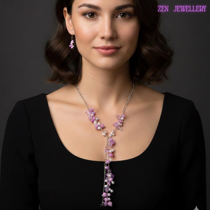 Romantic bohemian jewellery set with a handcrafted necklace, bracelet, and drop earrings made from pastel gemstone beads and silver chain accents. The necklace measures approximately 81 cm and features asymmetrical clustered bead arrangements in soft lilac, pink, and pearl white tones. Tiny silver spacers and polished bead surfaces reflect light beautifully, adding gentle sparkle and elegant movement. The bracelet measures approximately 19 cm and