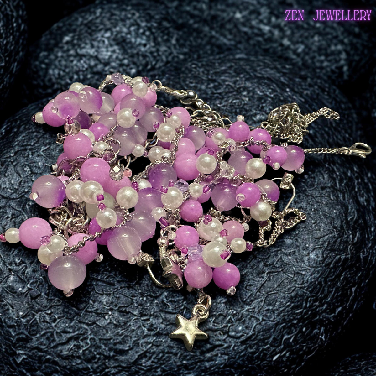 Feminine handcrafted necklace and bracelet set featuring delicate silver chains decorated with soft pastel gemstone clusters and matching dangling earrings. The glossy pink, lavender, and pearl white beads create a romantic boho appearance inspired by blossoms and delicate floral textures. Reflective silver accents provide gentle sparkle while the asymmetrical cascading bead arrangement creates elegant movement.