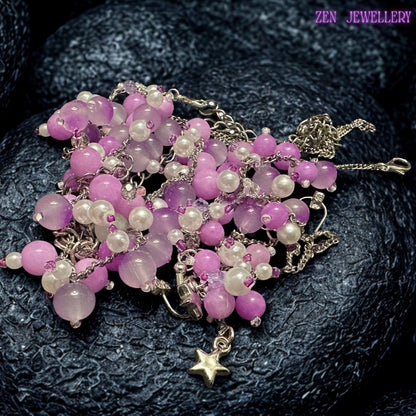 Feminine handcrafted necklace and bracelet set featuring delicate silver chains decorated with soft pastel gemstone clusters and matching dangling earrings. The glossy pink, lavender, and pearl white beads create a romantic boho appearance inspired by blossoms and delicate floral textures. Reflective silver accents provide gentle sparkle while the asymmetrical cascading bead arrangement creates elegant movement.