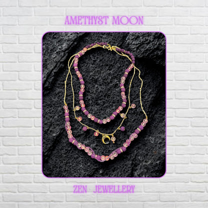 • Close-up view of the layered necklace showing polished translucent pink gemstone beads with a soft frosted glow contrasted against textured volcanic purple lava stone beads. Gold spacer rings with rhinestone sparkle separate the beads beautifully while the delicate gold chain drapes naturally across the dark decorative surface. The crescent moon charm becomes the focal point and adds mystical celestial elegance to the handmade artistic jeweller