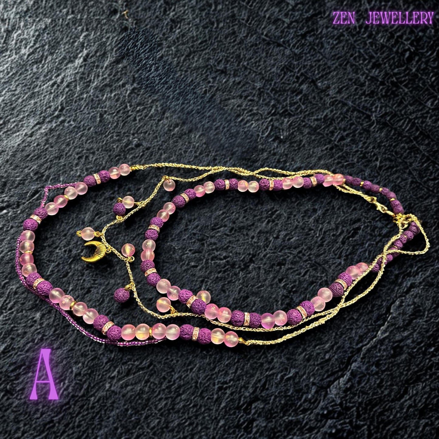 • Close-up photograph of the lower statement strand displaying handwoven pink seed bead details flowing between large translucent blush pink gemstone beads and matte purple lava stones. Small crystal spacer rings add subtle sparkle while the curved arrangement demonstrates the necklace flexibility and layered artistic design. The craftsmanship gives the jewellery set an elegant bohemian appearance suitable for festivals or evening styling.