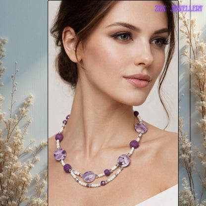 This romantic handmade necklace features glossy purple gemstone-style beads combined with textured lava stones and silver spacer accents. The soft lavender tones create a calming appearance while the layered design adds elegant depth and visual balance.