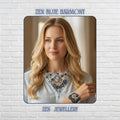 Handmade blue crochet necklace and bracelet set featuring layered circular textile motifs in dusty blue navy, ivory and cream tones with elegant white pearl embellishments arranged in a romantic bib style design against a dark textured background showing the intricate fibre art craftsmanship and couture statement appearance suitable for weddings, evening fashion and luxury bohemian styling.