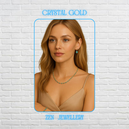 Elegant handmade crystal necklace and bracelet set displayed on a model featuring vibrant blue faceted crystals linked with delicate gold chain details. The rich crimson stones reflect warm light beautifully and create luxurious sparkle with every movement. Matching bracelet and necklace create a romantic coordinated jewellery look perfect for weddings, evening outfits, festive occasions, or feminine fashion styling. Necklace length is 60CM and b