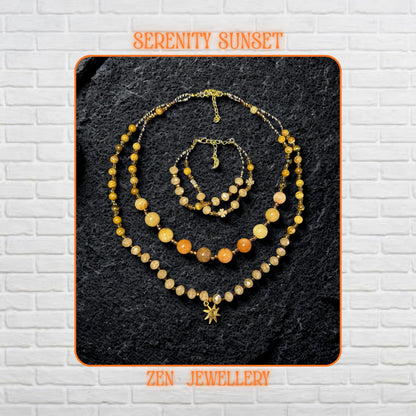 Handmade jade gemstone necklace and bracelet set featuring warm yellow jade, honey jade, amber beads, and champagne crystal beads with gold spacer details and a delicate gold clasp. The layered design sits on a dark textured stone background and creates a rich earthy luxury look with graceful movement.