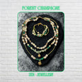 • Elegant handmade layered AVENTURINE jewellery set displayed on a dark volcanic stone background, featuring three delicate necklace strands and a matching double strand bracelet in soft green, ivory, cream, and earthy tones. The design combines polished aventurine gemstones, creamy jade style beads, green striped malachite style beads, metallic seed beads, rhinestone spacer rings, and warm gold accents that reflect light beautifully for a luxuri
