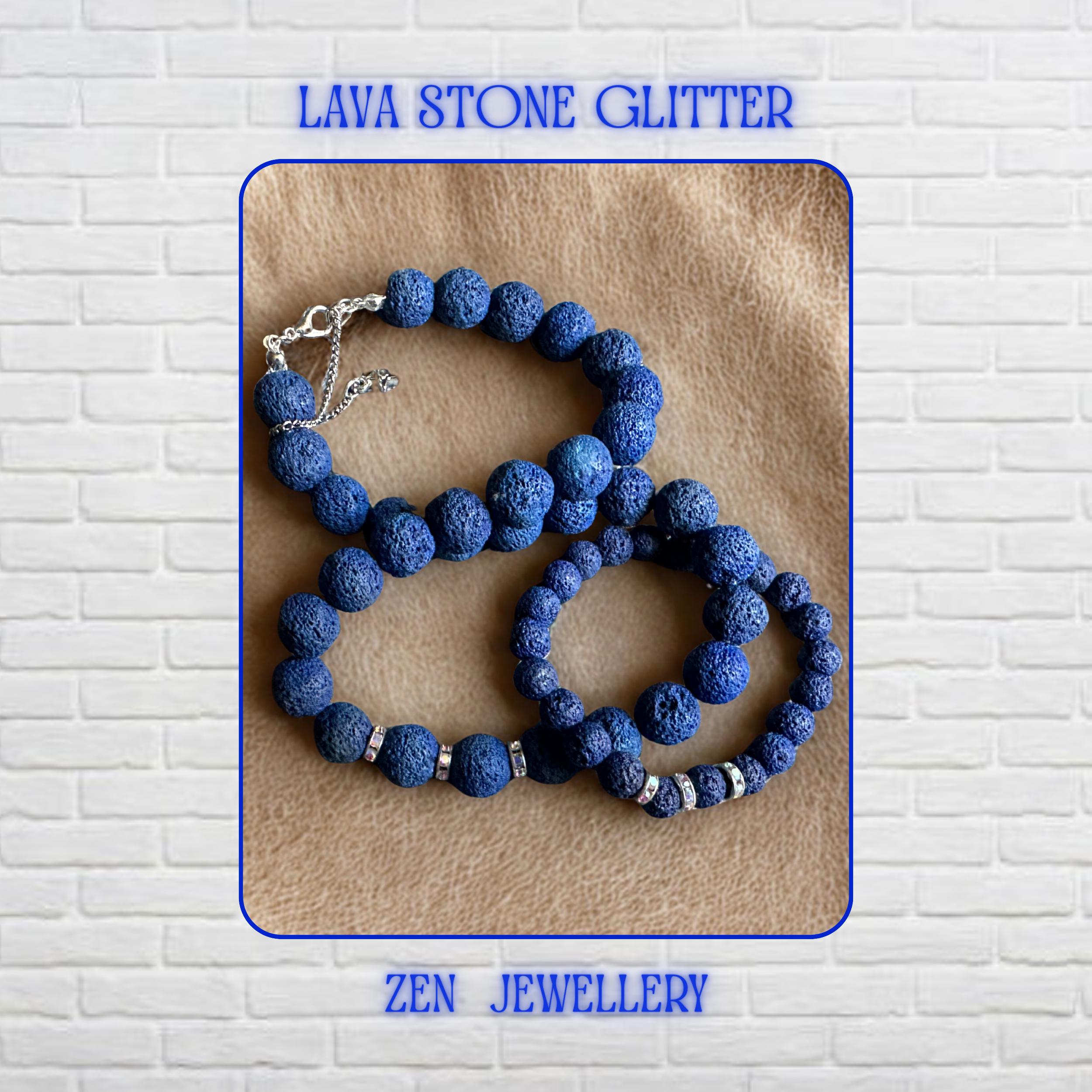 A bold navy blue lava stone jewellery set designed with graduated volcanic beads and shimmering rhinestone spacers. The necklace combines different bead sizes for balance and visual depth, while the matching bracelet mirrors the same elegant handmade style. The porous lava texture gives the set a calming organic appearance with modern bohemian charm.